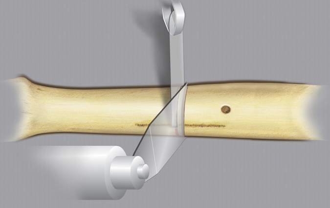 Second complete cut performed while an extra blade is held in the first cut. The extra blade provides a guide to the plane for the second cut.